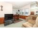 Living room with home bar and large window at 214 Covent Garden Ave, Davenport, FL 33897