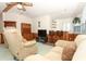 Living room features two recliners and a home bar at 214 Covent Garden Ave, Davenport, FL 33897