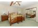 Main bedroom with king-size bed, dresser, and mirrored closet at 214 Covent Garden Ave, Davenport, FL 33897