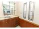 Wet bar with sink and wood cabinetry at 214 Covent Garden Ave, Davenport, FL 33897