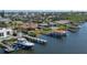 Aerial view of waterfront home with boat and dock at 218 S Venetian Way, Port Orange, FL 32127