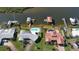 Aerial view of waterfront homes with private pools and boat docks at 218 S Venetian Way, Port Orange, FL 32127