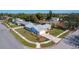 A beautiful aerial view of a corner lot home showcasing the well-manicured lawn and landscaping at 2207 Winter Woods Blvd, Winter Park, FL 32792