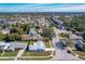 Expansive aerial view of a residential neighborhood featuring tree-lined streets and a variety of home styles at 2207 Winter Woods Blvd, Winter Park, FL 32792