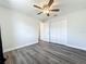 Clean bedroom with wood-look flooring, a ceiling fan, and a closet at 2207 Winter Woods Blvd, Winter Park, FL 32792