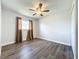 Spacious bedroom with hardwood floors and ceiling fan at 2207 Winter Woods Blvd, Winter Park, FL 32792