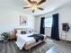 Well-appointed bedroom with a comfy bed, modern decor, and natural light at 2207 Winter Woods Blvd, Winter Park, FL 32792