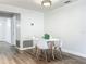 White table and chairs in a bright dining area with hardwood floors at 2207 Winter Woods Blvd, Winter Park, FL 32792