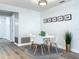 Cozy dining area featuring modern furniture, light gray walls, and natural light at 2207 Winter Woods Blvd, Winter Park, FL 32792