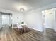 Bright dining room featuring luxury vinyl floors with a modern table and chair set at 2207 Winter Woods Blvd, Winter Park, FL 32792