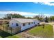 Side view of the house, showcasing a well-maintained lawn at 2207 Winter Woods Blvd, Winter Park, FL 32792