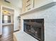 White brick fireplace with wood burning fire in living room at 2207 Winter Woods Blvd, Winter Park, FL 32792