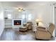 Living room with a fireplace and built-in shelving at 2207 Winter Woods Blvd, Winter Park, FL 32792