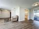 Light and airy living room with a beige couch and wood-look floors at 2207 Winter Woods Blvd, Winter Park, FL 32792