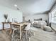 Staged living room featuring wood floors, modern furniture, recessed lighting and neutral wall paint at 2207 Winter Woods Blvd, Winter Park, FL 32792