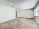 Bright living room featuring light wood flooring, neutral paint and large window at 2207 Winter Woods Blvd, Winter Park, FL 32792