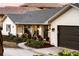 White brick home with dark brown garage door at 2501 Jennifer Hope Blvd, Longwood, FL 32779