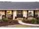 Inviting front porch with rocking chairs and landscaping at 2501 Jennifer Hope Blvd, Longwood, FL 32779