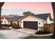 White brick house with dark gray garage door and landscaping at 2501 Jennifer Hope Blvd, Longwood, FL 32779