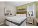 Bedroom with king-size bed and wood accents at 2628 Calistoga Ave, Kissimmee, FL 34741