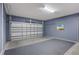 Spacious two-car garage with finished walls and a clean epoxy floor, ready for vehicles and storage at 2628 Calistoga Ave, Kissimmee, FL 34741