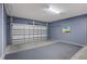 Two-car garage with gray walls and floor at 2628 Calistoga Ave, Kissimmee, FL 34741