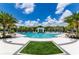 Expansive pool area with inviting lounge chairs and palm trees under a sunny sky, offering a resort-like experience at 2628 Calistoga Ave, Kissimmee, FL 34741