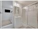 Bathroom with vanity, shower, and mirror at 2711 Angel Mist Ct, Mascotte, FL 34753