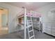 bedroom with a white bunk bed and storage at 2711 Angel Mist Ct, Mascotte, FL 34753