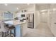 Modern kitchen with stainless steel appliances and white cabinetry at 2711 Angel Mist Ct, Mascotte, FL 34753