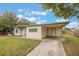 Front view of a ranch-style home with a carport at 2914 Sprague Dr, Orlando, FL 32826