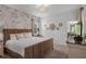 Main bedroom with wicker bed frame and patterned wall at 2957 Beach Palm Ave, Kissimmee, FL 34747