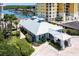 Community clubhouse with a gray metal roof and covered walkway at 3 Riverwalk Dr # 405, New Smyrna Beach, FL 32169