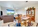 Bright dining area with a wooden table and chairs, showcasing a view to the living room at 3 Riverwalk Dr # 405, New Smyrna Beach, FL 32169