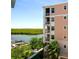 Condo building exterior showcasing water views and lush landscaping at 3 Riverwalk Dr # 405, New Smyrna Beach, FL 32169