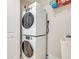 Convenient laundry room with stackable washer and dryer at 3 Riverwalk Dr # 405, New Smyrna Beach, FL 32169