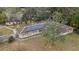 Aerial view of a ranch style home with solar panels at 30845 Westward Ho Ave, Sorrento, FL 32776