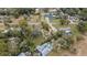 Aerial view of property with pool and surrounding homes at 30845 Westward Ho Ave, Sorrento, FL 32776