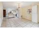 Kitchen features island, white cabinets and appliances at 30845 Westward Ho Ave, Sorrento, FL 32776