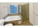 Clean bathroom with a large soaking tub and shower at 311 Silver Pine Dr, Lake Mary, FL 32746