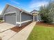 Gray house with a two-car garage and walkway at 311 Silver Pine Dr, Lake Mary, FL 32746