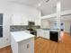 Modern kitchen with white cabinets and quartz countertops at 311 Silver Pine Dr, Lake Mary, FL 32746