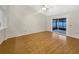 Living room with wood floors and sliding glass doors at 311 Silver Pine Dr, Lake Mary, FL 32746