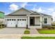 Charming single-story home featuring a two-car garage and a beautifully landscaped front yard at 341 Sunbrooke Dr, Groveland, FL 34736