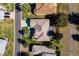 Aerial view of single-Gathering home with landscaped yard at 3566 Tropical Seas Loop, Tavares, FL 32778