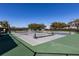 Community tennis courts with surrounding trees at 3566 Tropical Seas Loop, Tavares, FL 32778