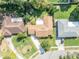 A bird's eye view of the home, highlighting its proximity to neighboring properties and street layout at 4130 Floralwood Ct, Orlando, FL 32812