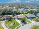 Expansive aerial shot showcasing this home's lush landscaping, circular driveway, and inviting curb appeal at 4130 Floralwood Ct, Orlando, FL 32812