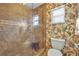 Stylish bathroom with marble shower, floral wallpaper and modern toilet at 4130 Floralwood Ct, Orlando, FL 32812