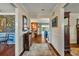 Inviting hallway featuring hardwood floors and neutral colored walls at 4130 Floralwood Ct, Orlando, FL 32812